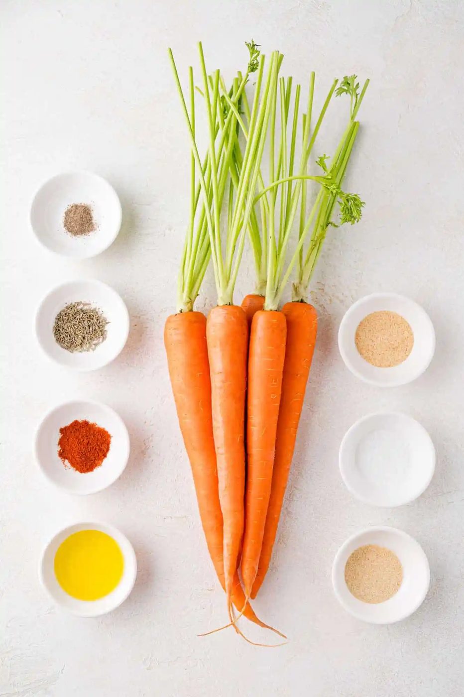 Ingredients needed for recipe, including fresh carrots.