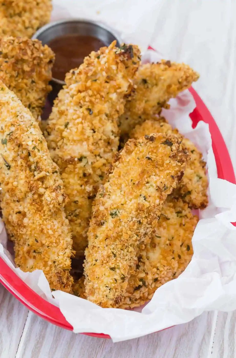 Crispy chicken fingers in a basket.