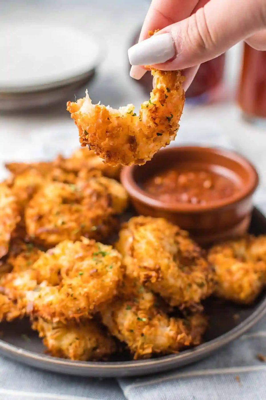 Crispy shrimp with a bite out of it.