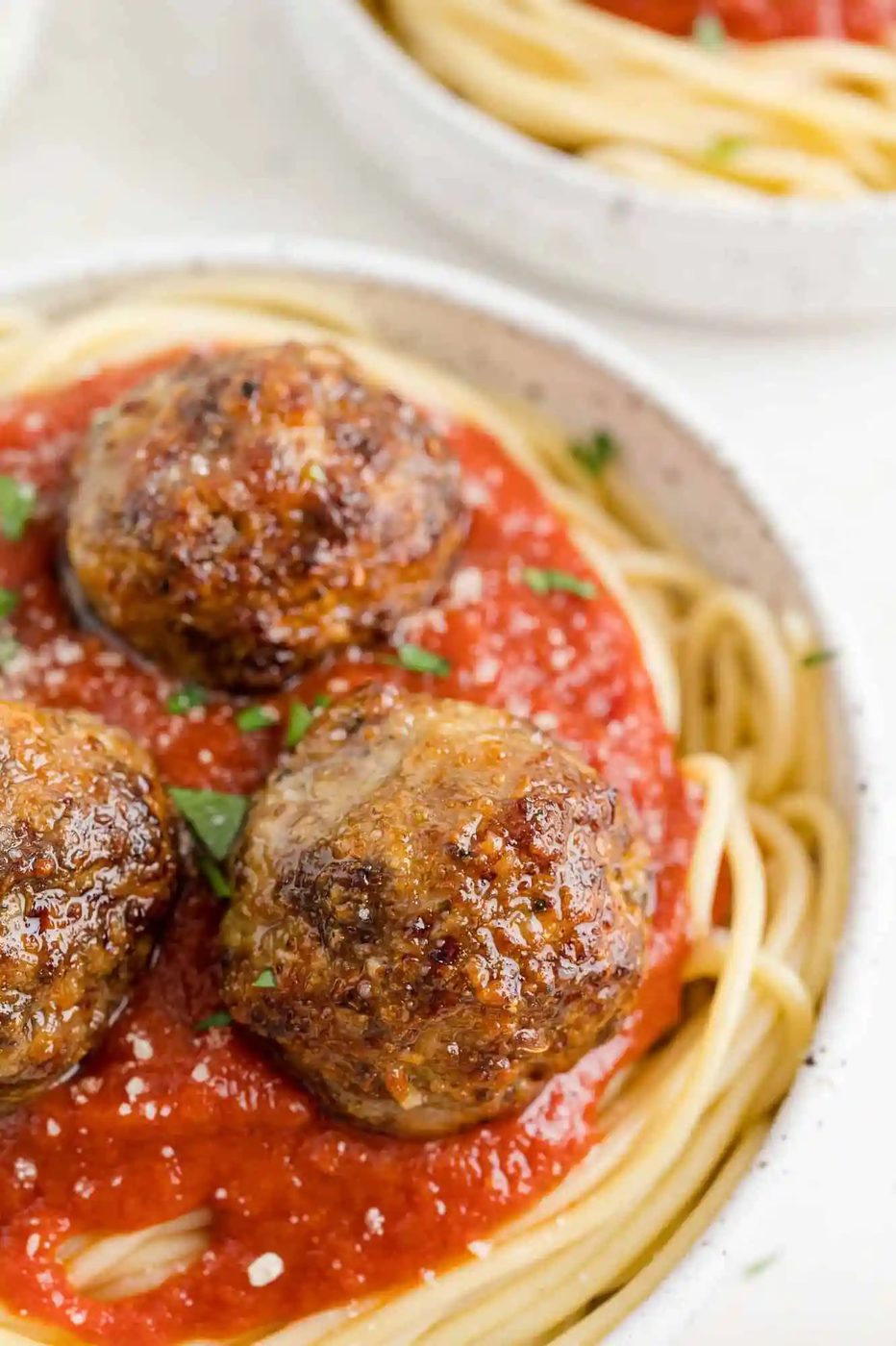 Meatballs atop spaghetti.