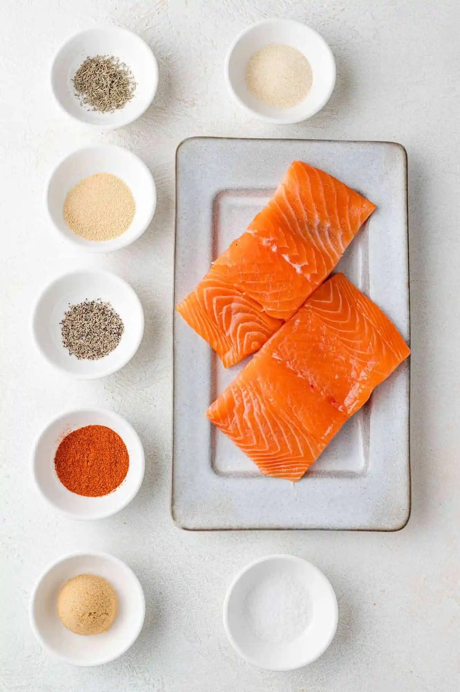 Ingredients needed for salmon bites, including two salmon fillets.