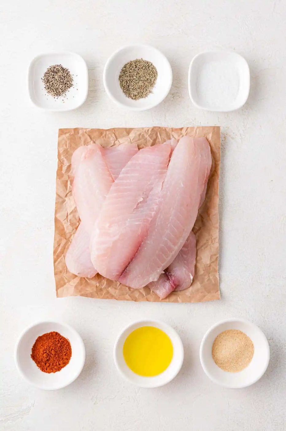 Overhead view of ingredients needed for air fryer tilapia.