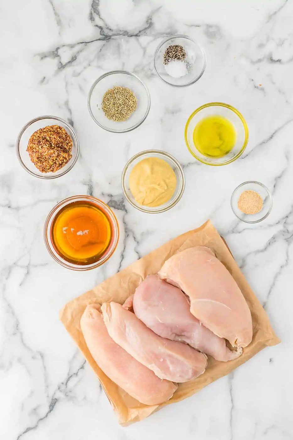 Overhead view of ingredients needed including two types of mustard.