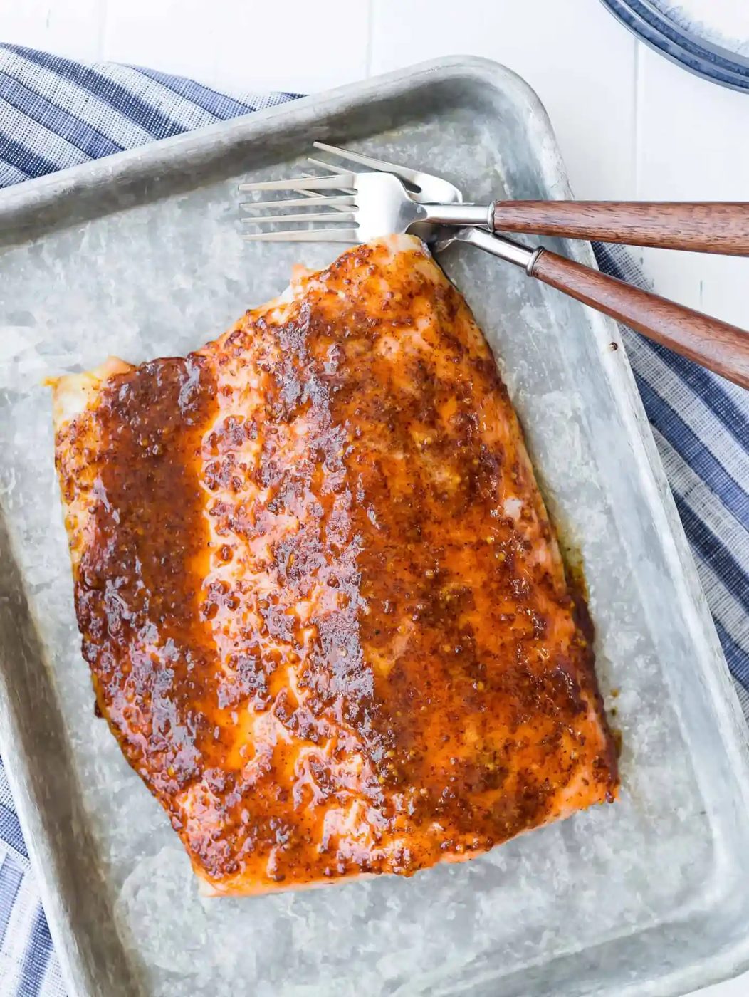 Overhead view of maple mustard baked salmon on a sheet pan.