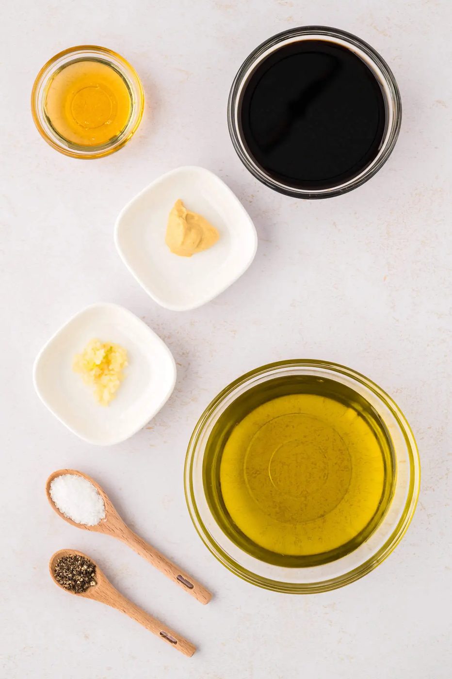 Overhead view of ingredients needed for balsamic vinaigrette dressing.