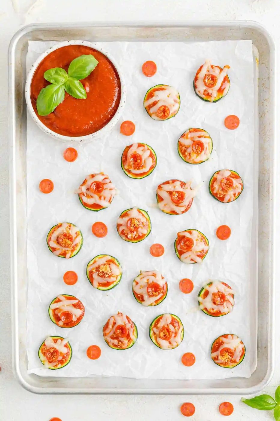 Pizza bites on a sheet pan.