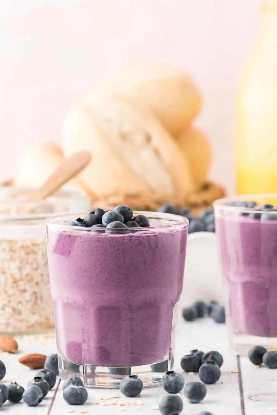 Blueberry smoothie topped with fresh blueberries.