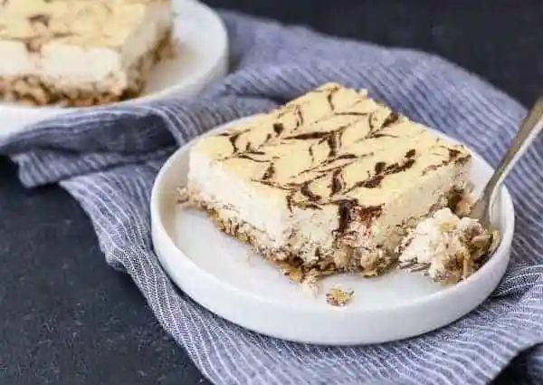 Front view of a serving of cheesecake.