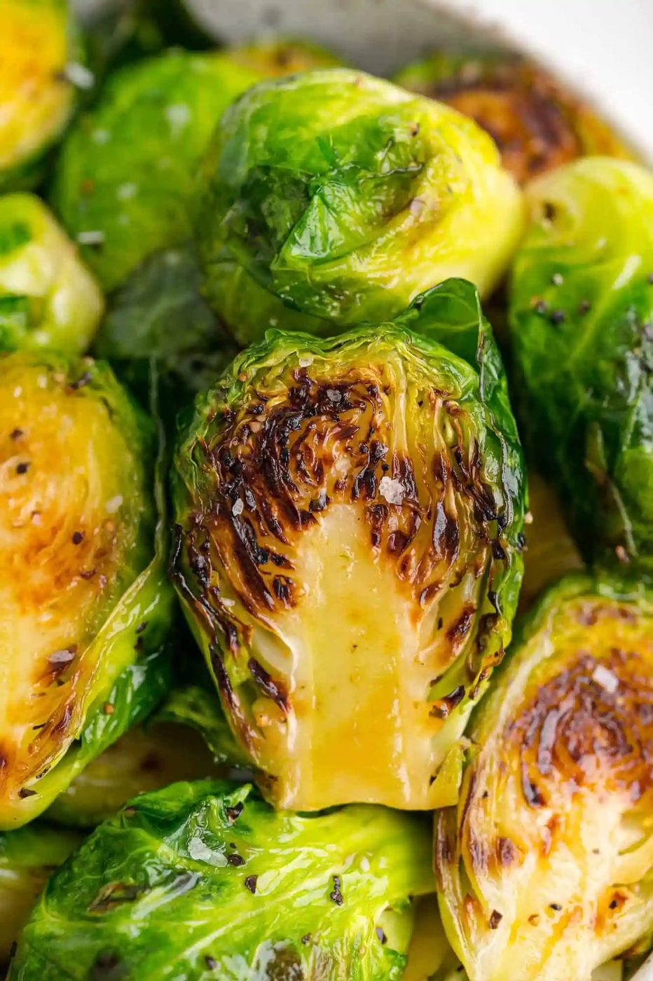 Close up of evenly sautéed Brussels sprouts.