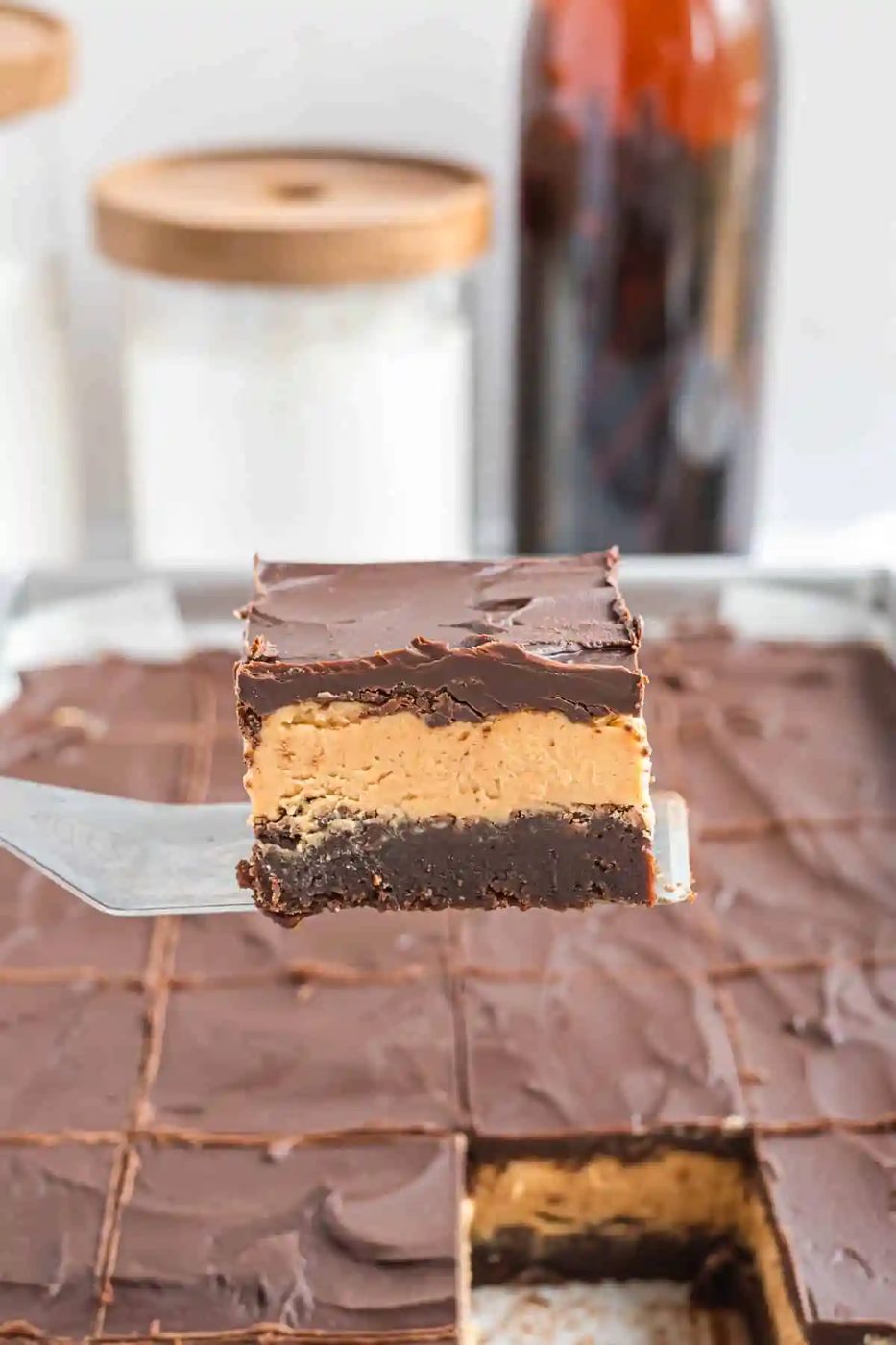 Buckeye brownie being lifted from a pan.