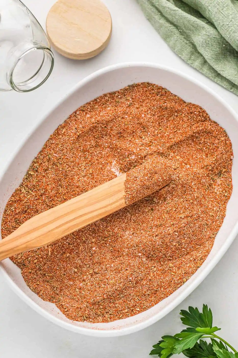 Cajun seasoning in a large shallow bowl.