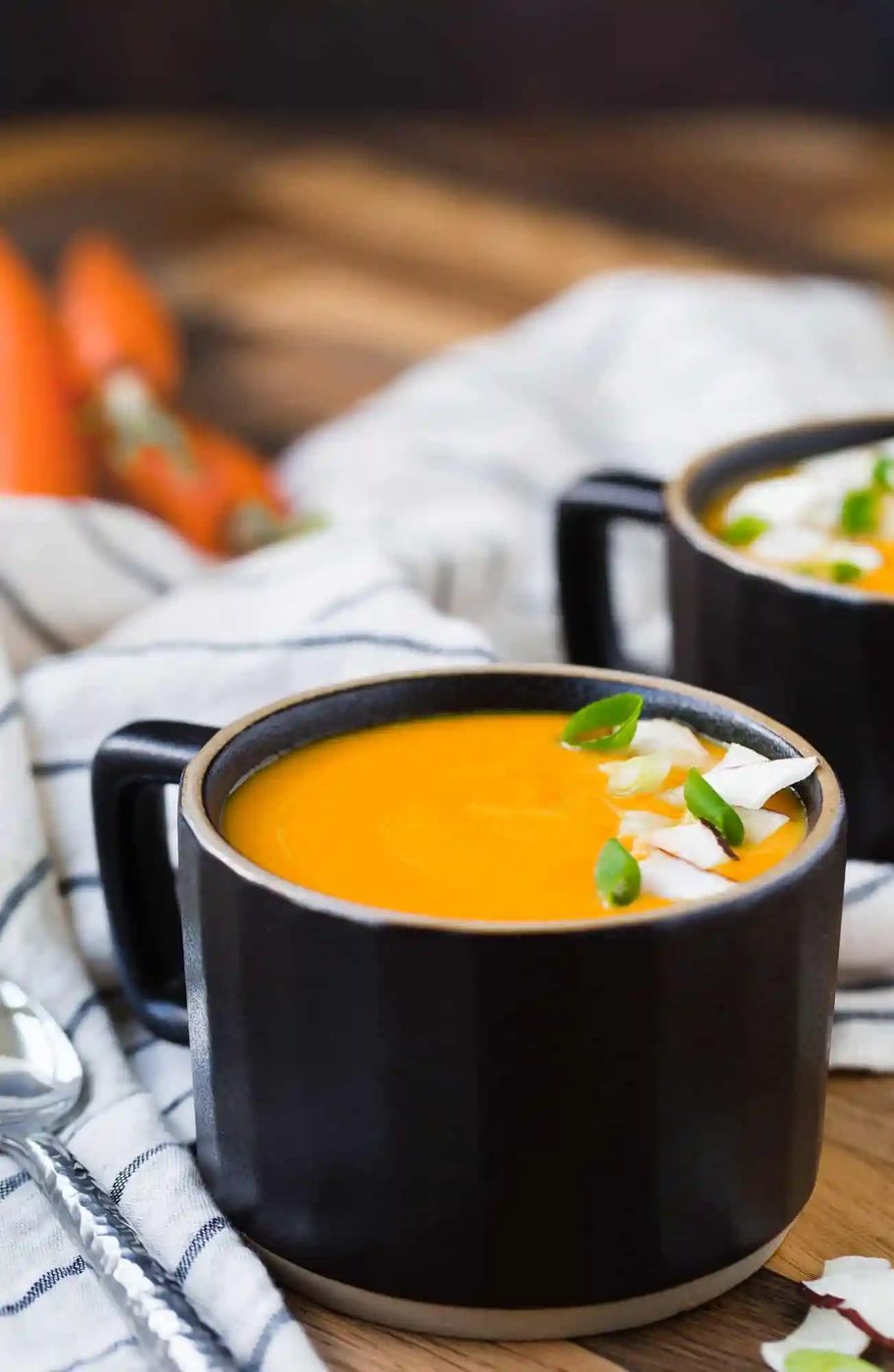 Soup in a black mug style bowl.