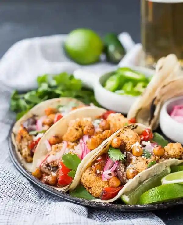 Front closeup of three assembled cauliflower tacos.