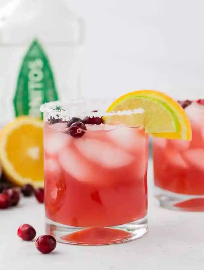 This cranberry margarita recipe is a festive addition to your Thanksgiving or Christmas menu, but is 100% rich all year round!