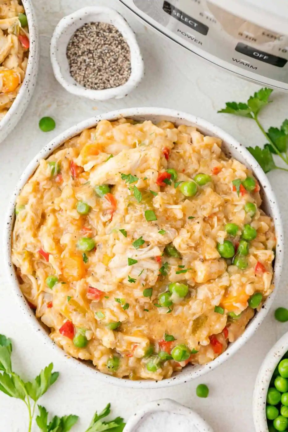 Crockpot chicken and rice in a large serving bowl.