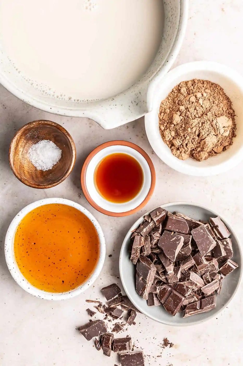 Overhead view of ingredients needed to make oat milk hot chocolate recipe.