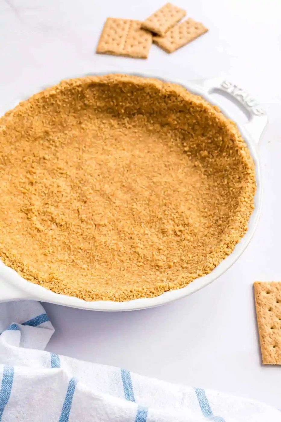 From-scratch graham cracker crust in a white pie plate.
