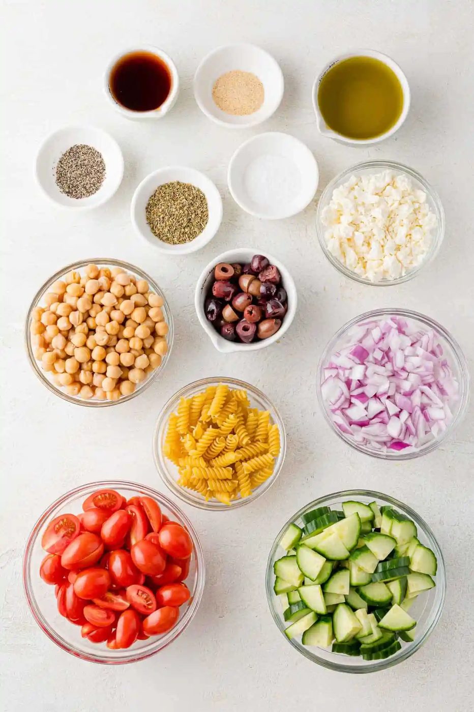 Overhead view of ingredients needed for recipe, including rotini pasta.