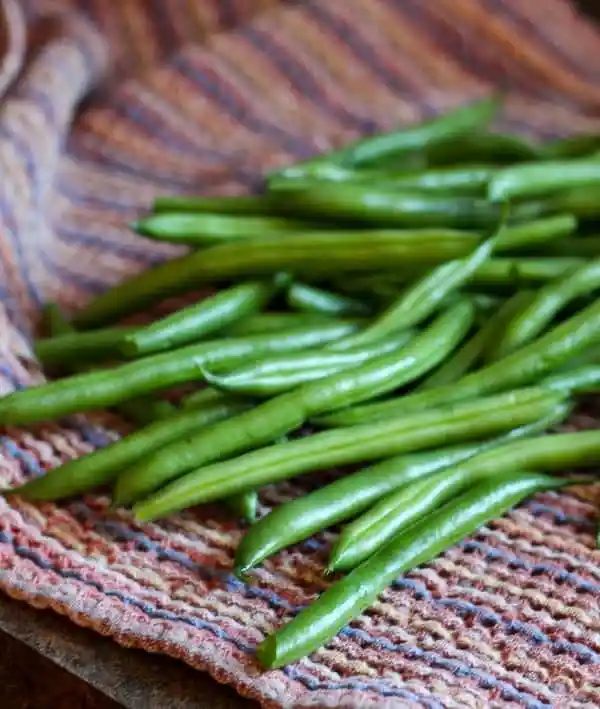 Roasted Green Beans with Parmesan and Basil - Get the straightforward and rich side dish recipe on
