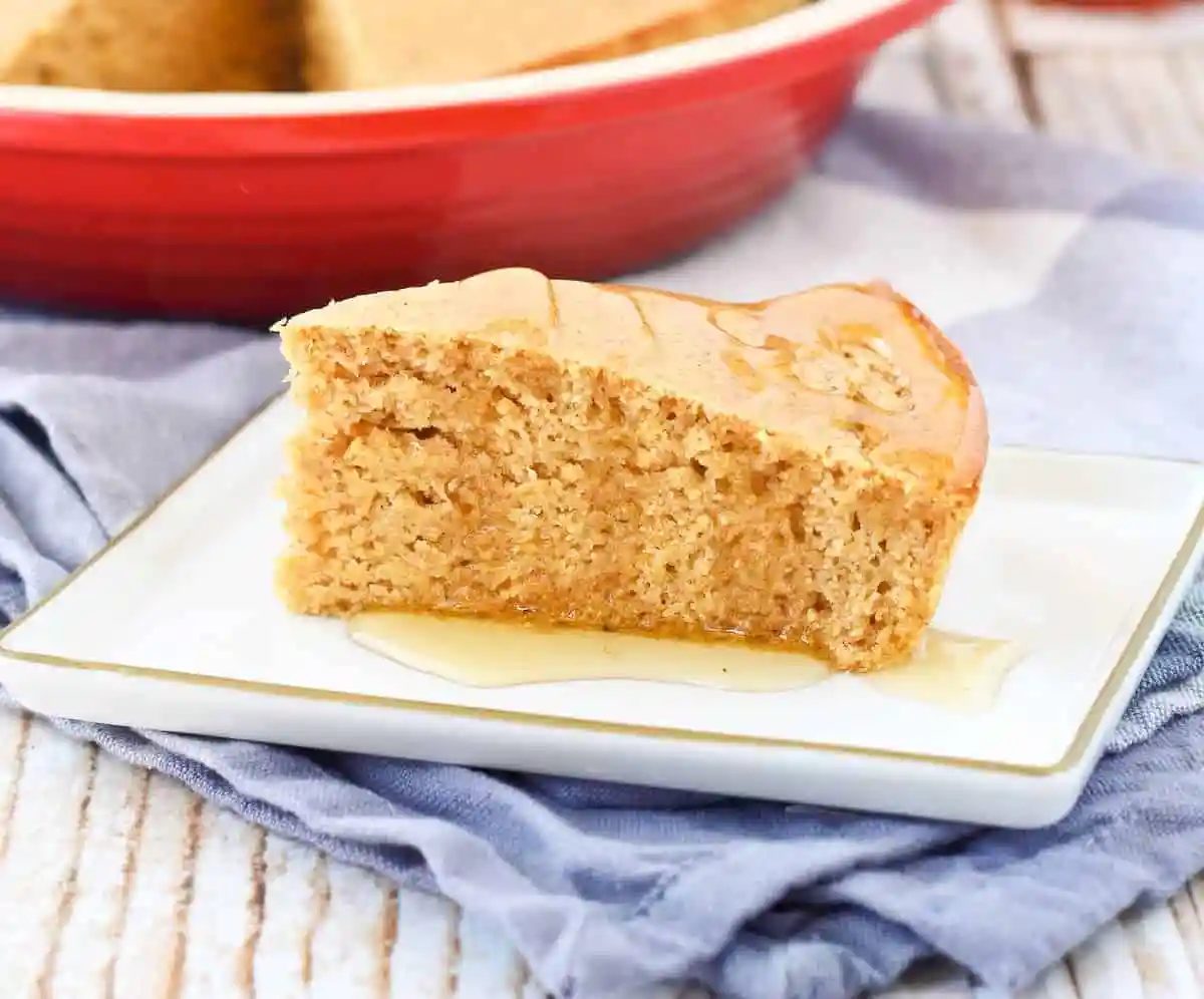 Lighter whole wheat cornrbead on a rectangular plate.