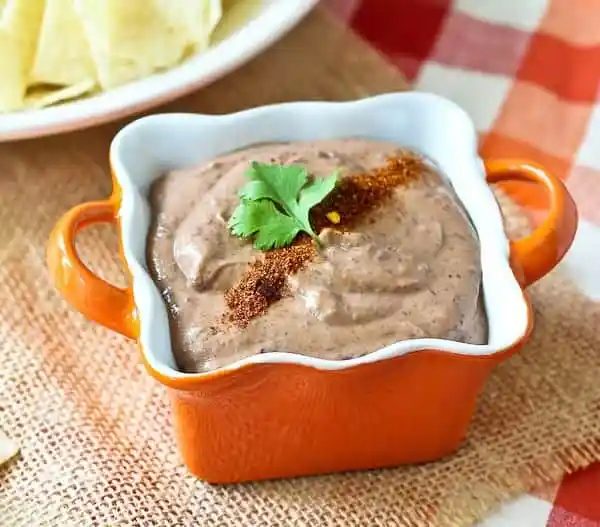 Bean dip topped with taco seasoning.