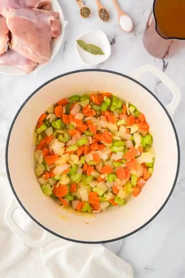 Sauteed veggies in a large pot.