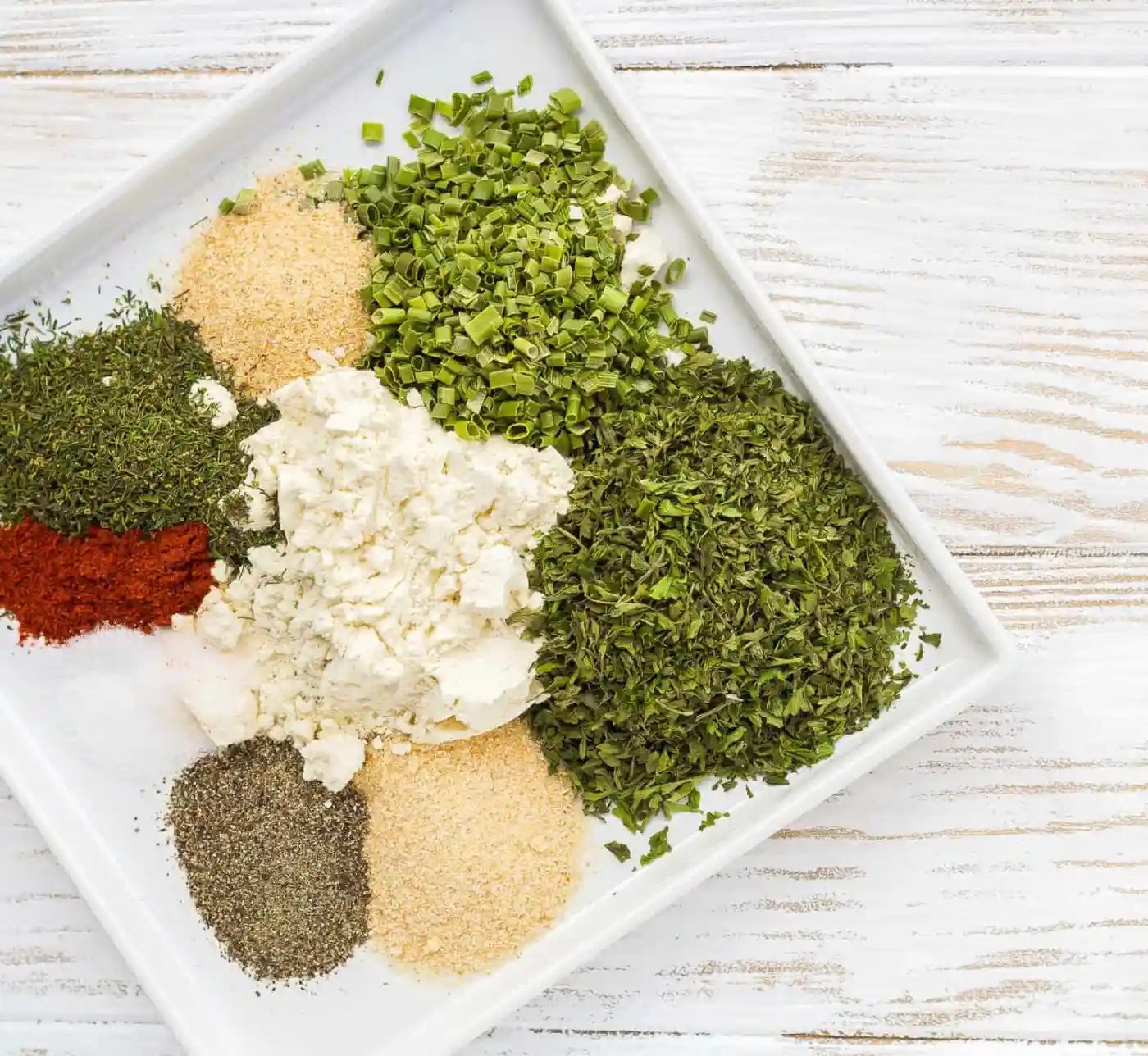 Ranch seasoning mix ingredients on a plate.