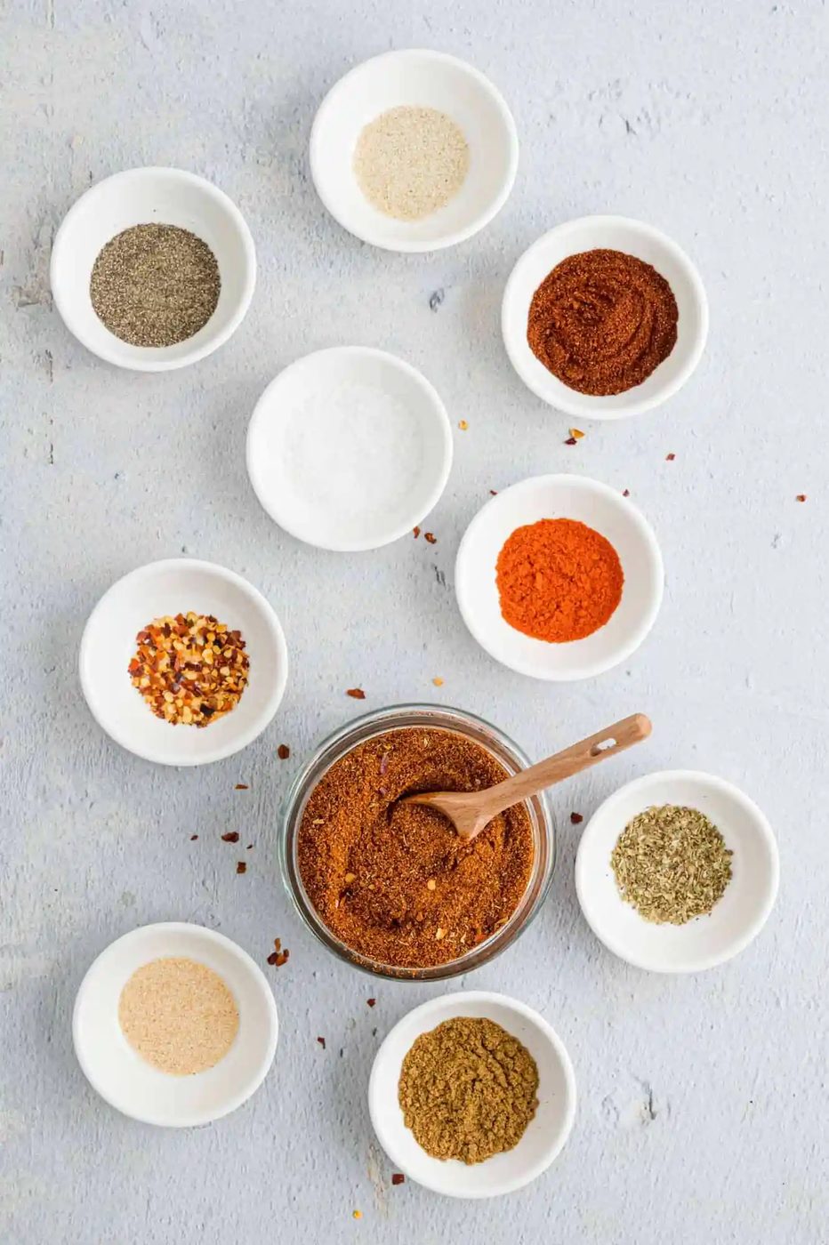 Taco seasoning ingredients in small individual bowls.