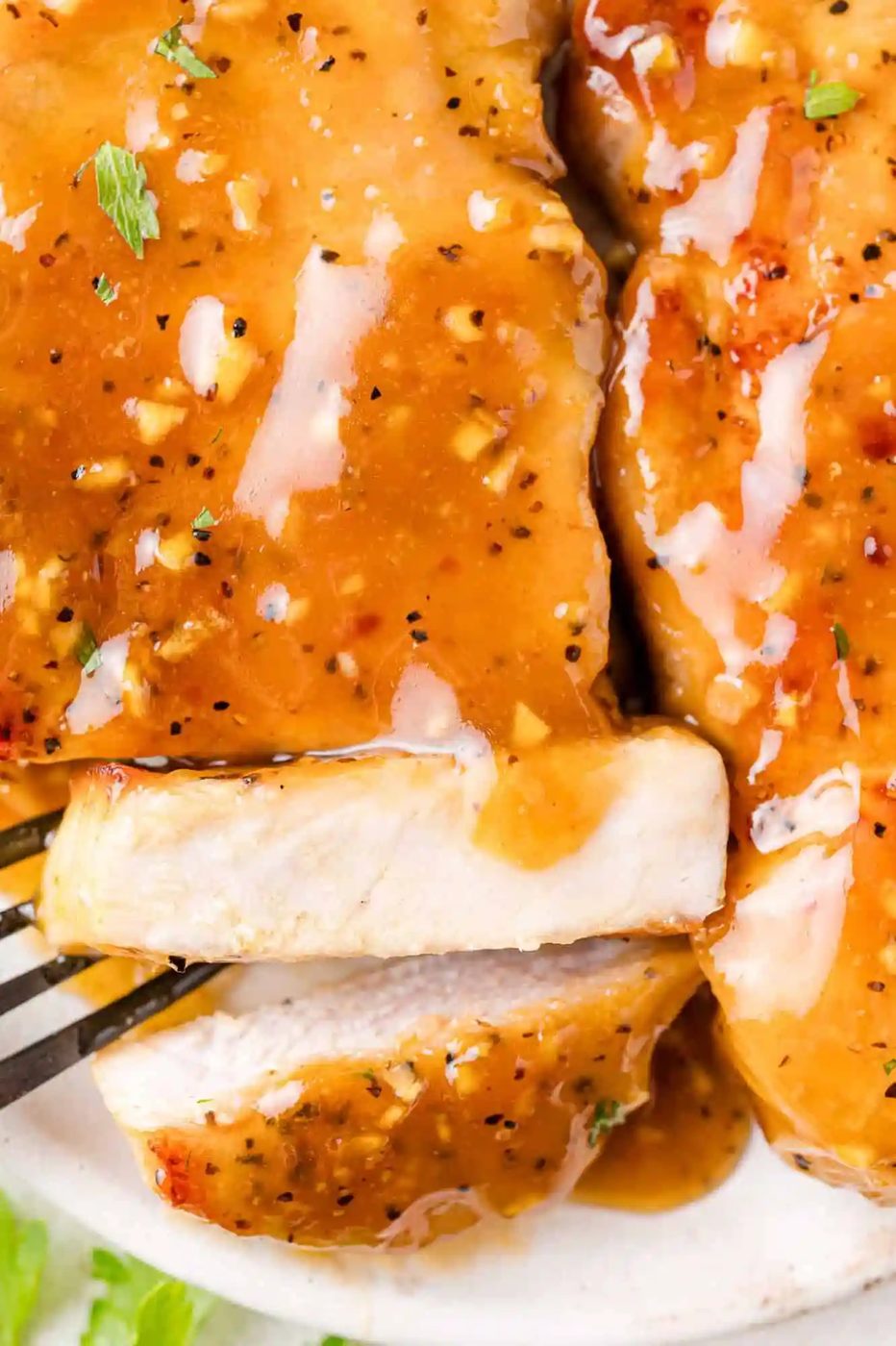 Honey garlic pork chop, cut to show inside.