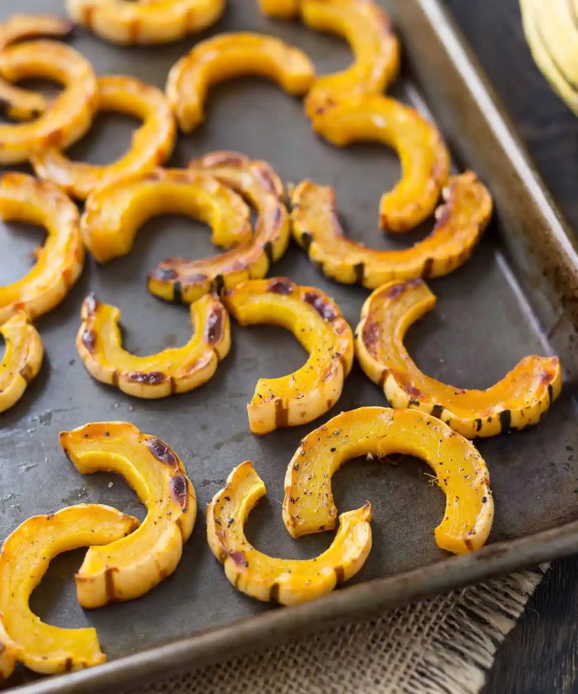 Roasted squash on a sheet pan.