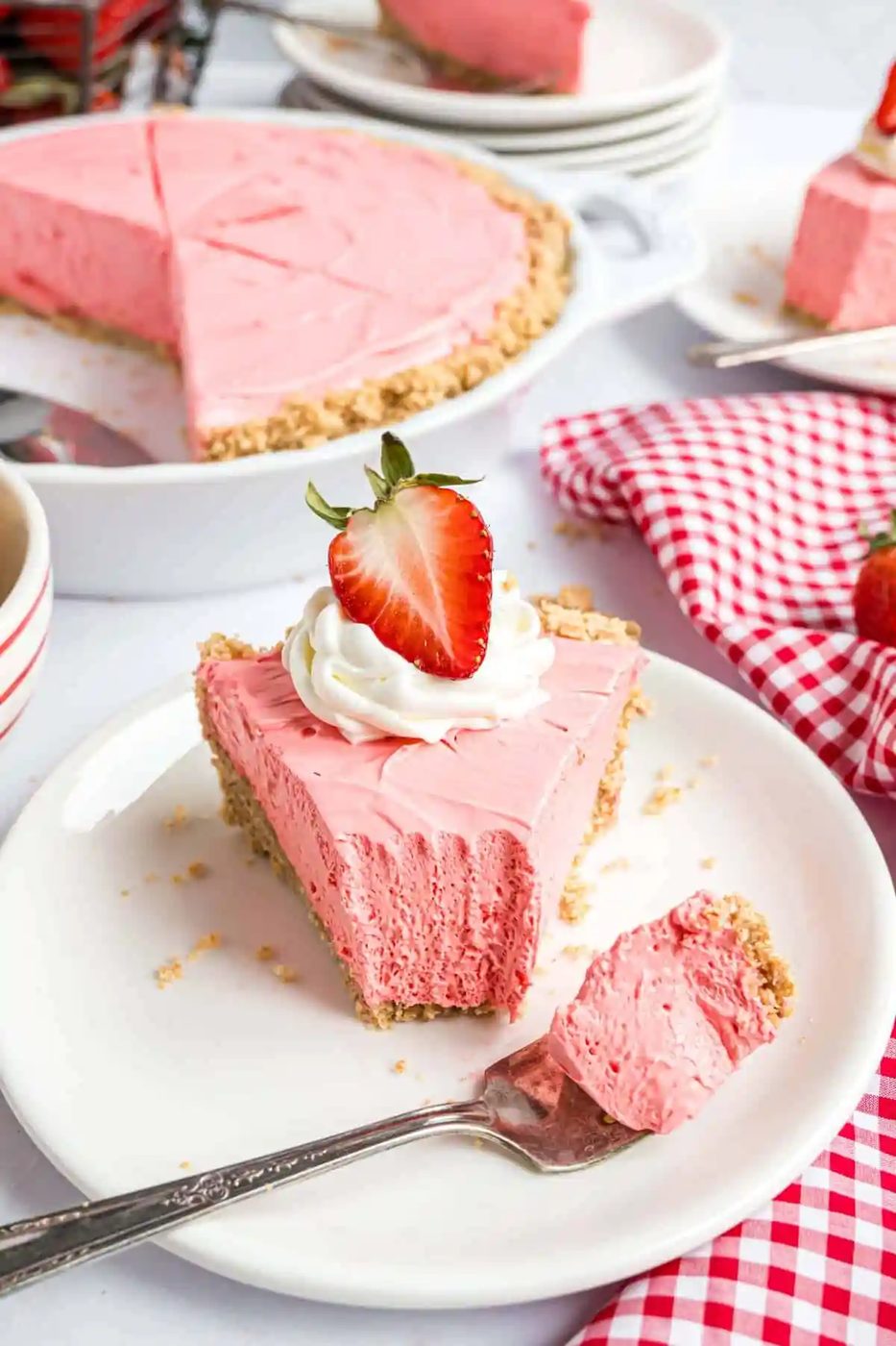 Piece of Kool Aid pie with a bite removed.
