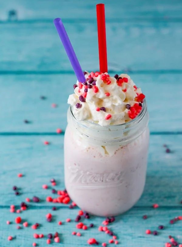 Nerds milkshake in a Mason jar.