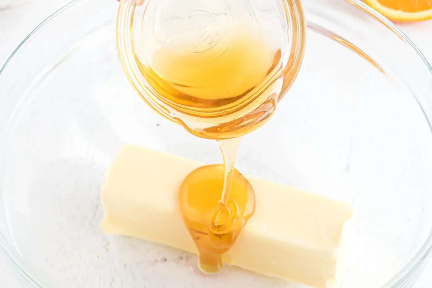 Honey being added to butter.