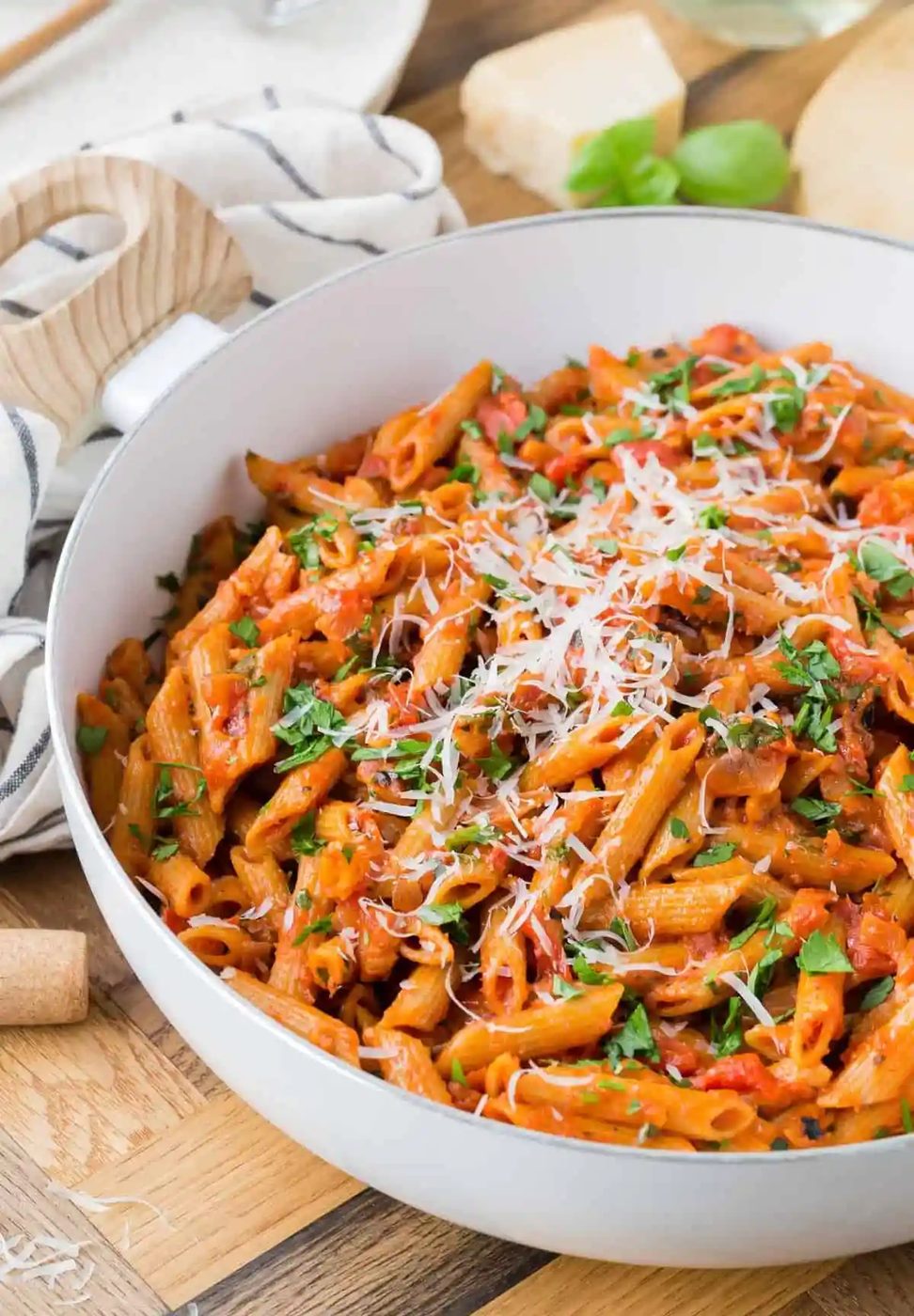 Pasta with tomato sauce in a white pan.