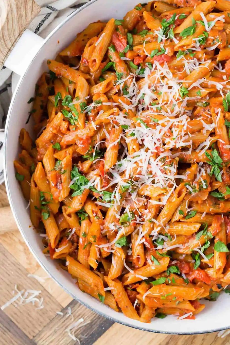 Close up of whole wheat penne in a tomato sauce.