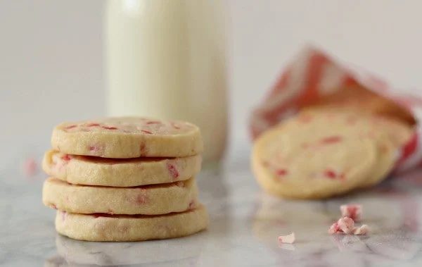 Front closeup of stack of cookies, with mint chips scattered.