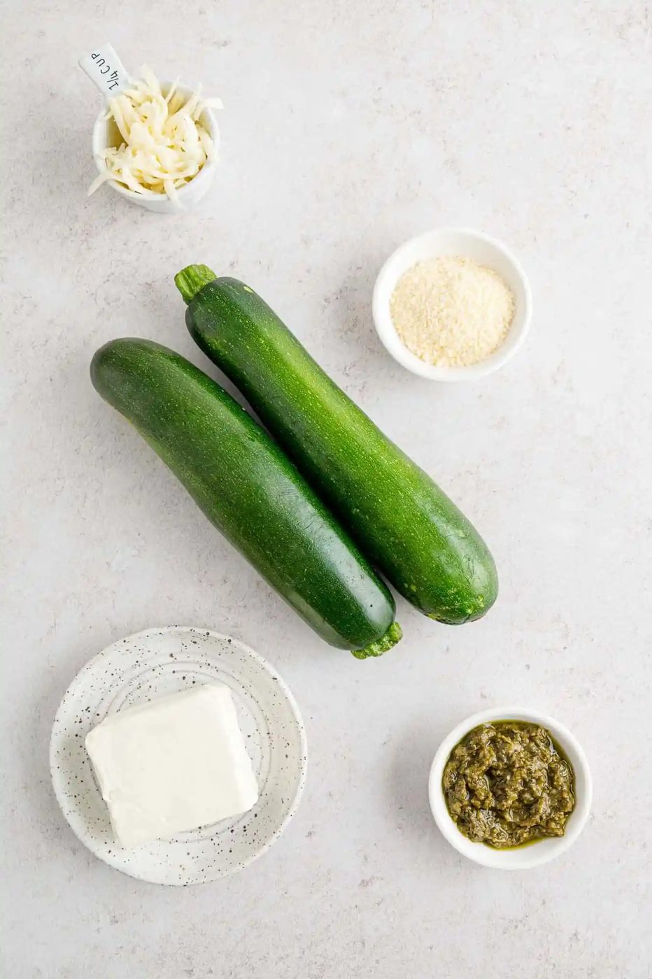 Ingredients needed for recipe, including two fresh zucchini.