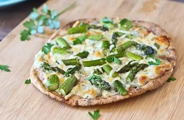 Pita Flatbreads on a wooden cutting board.