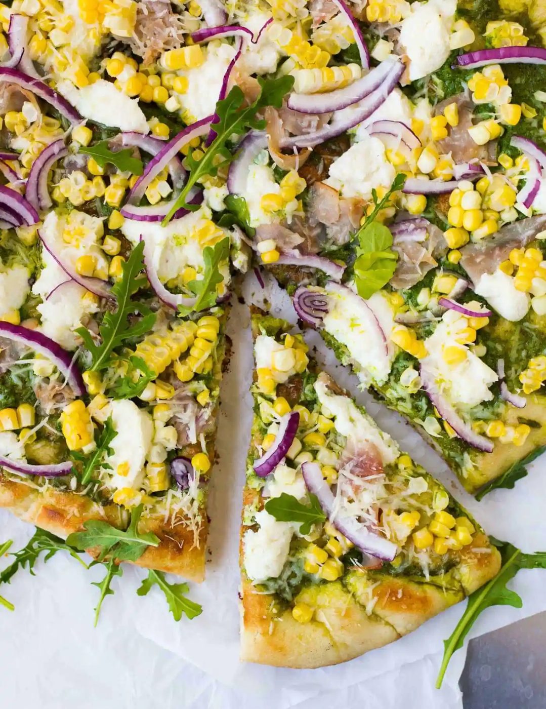 Grilled Pizza, served with Arugula Pesto, Corn, & Ham