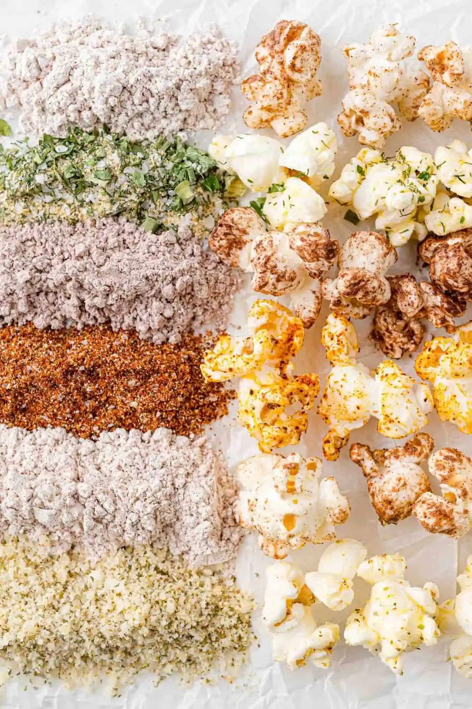Finished popcorn next to it's seasoning mix, lined up from top to bottom.