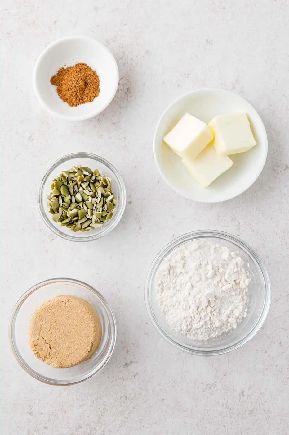 Ingredients needed for streusel topping, each in separate bowls.