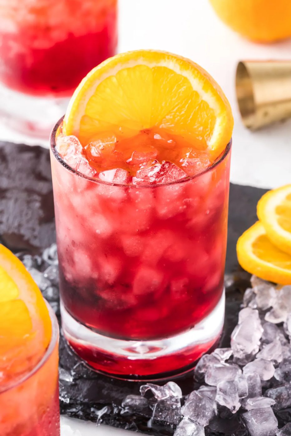 Spritzer made with red wine and orange liqueur and pellet ice.