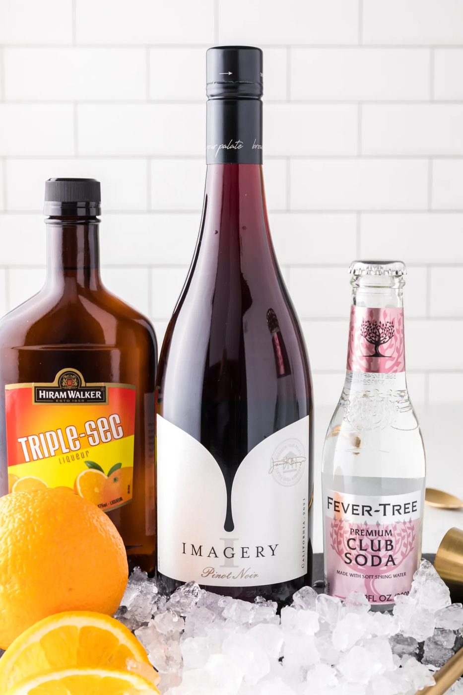 Ingredients needed for a red wine sprtizer.
