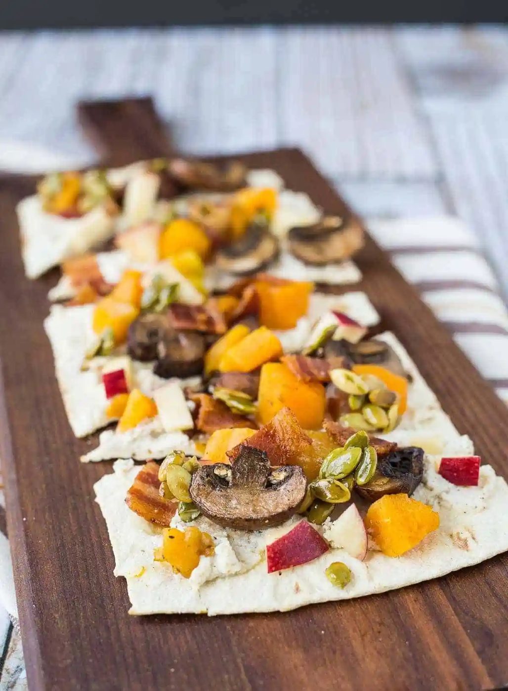 Ricotta Flatbread, served with Bacon, Squash, Apples and Maple Pepitas