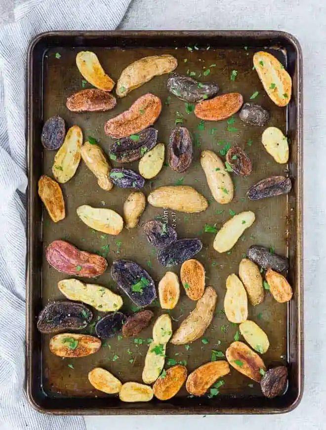 Overhead view of roasted potatoes on sheet pan.