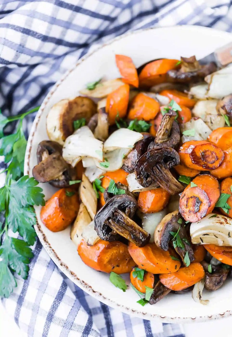 Cooked vegetables in a bowl with parsley.