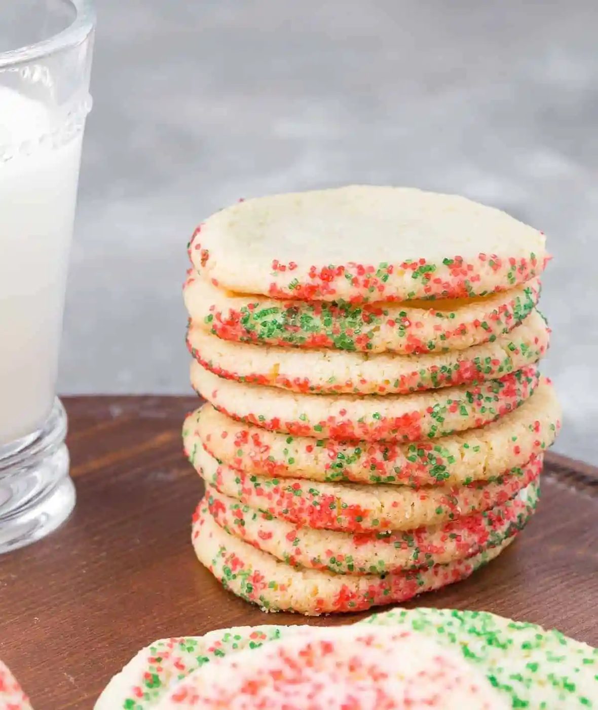 Stack of slice and bake cookies with red and green decorators sugar.