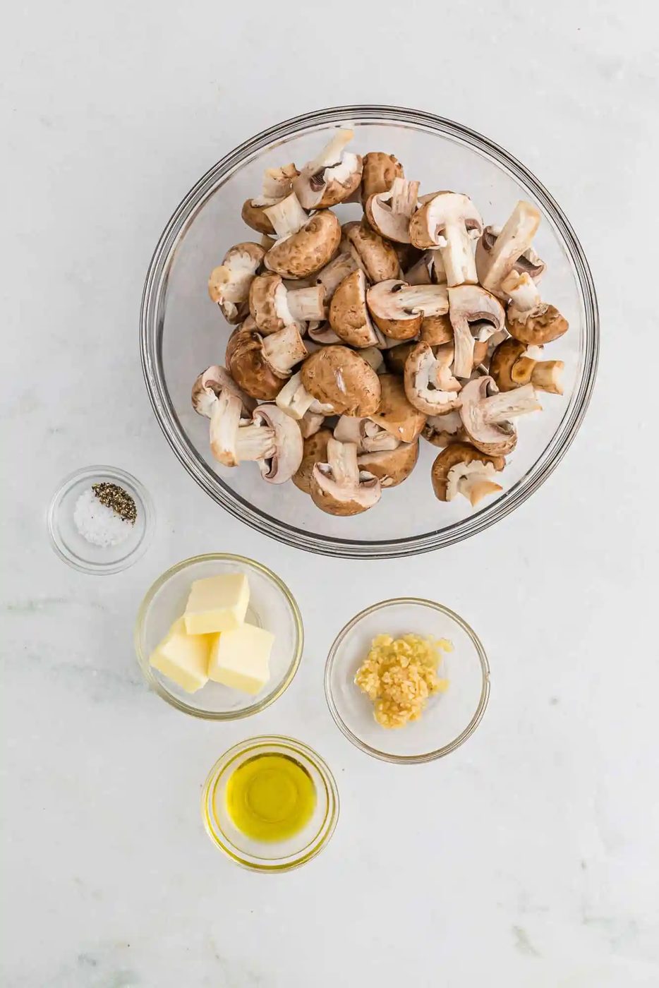 Ingredients needed for recipe including mushrooms and garlic.