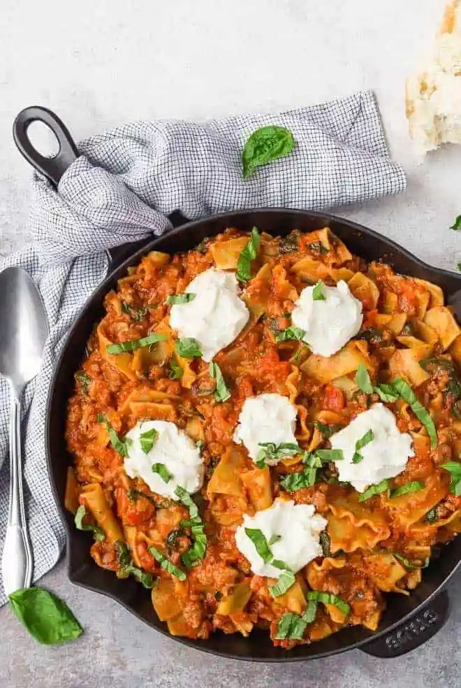 Love lasagna but hate fussing with layering everything up? This straightforward skillet lasagna is going to make your life way easier. It's just as rich, but with a fraction of the work.