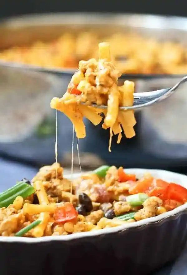 Closeup of a forkful of mac and cheese.